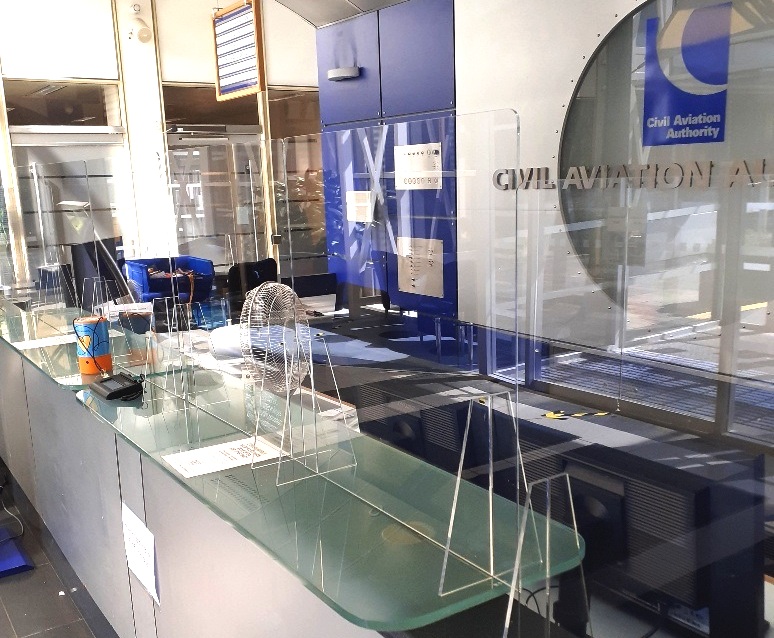 Covid 19 screens at civil aviation authority desk