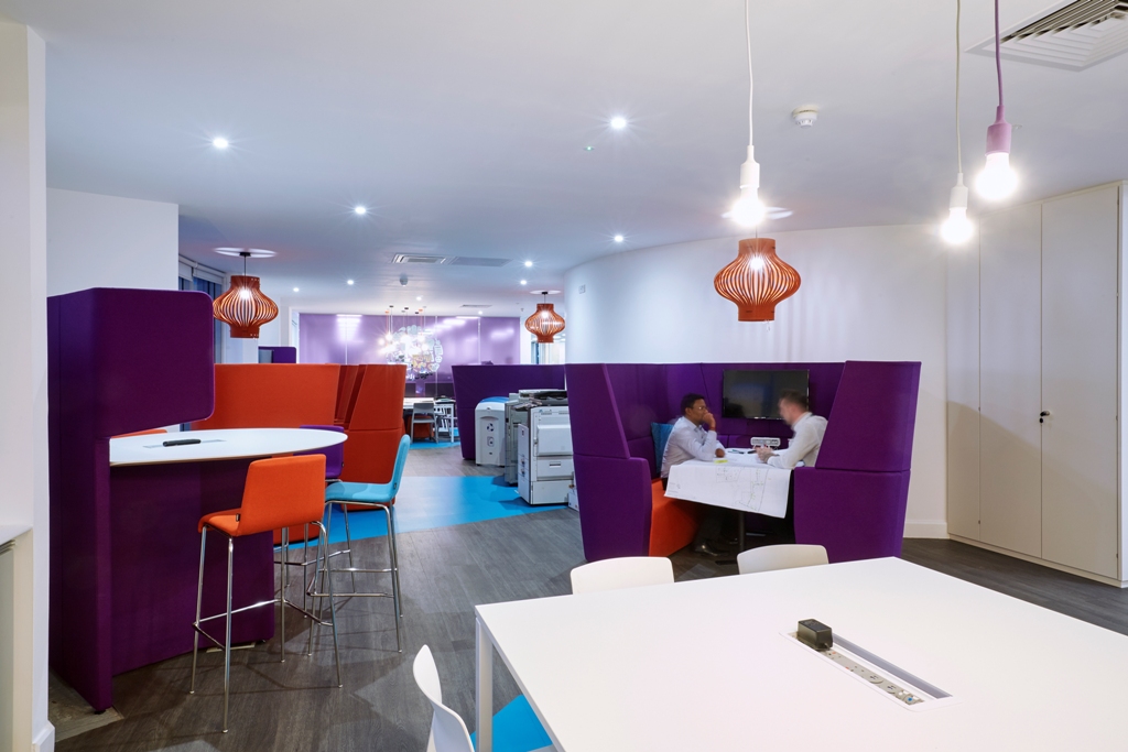 white office desking with green chairs