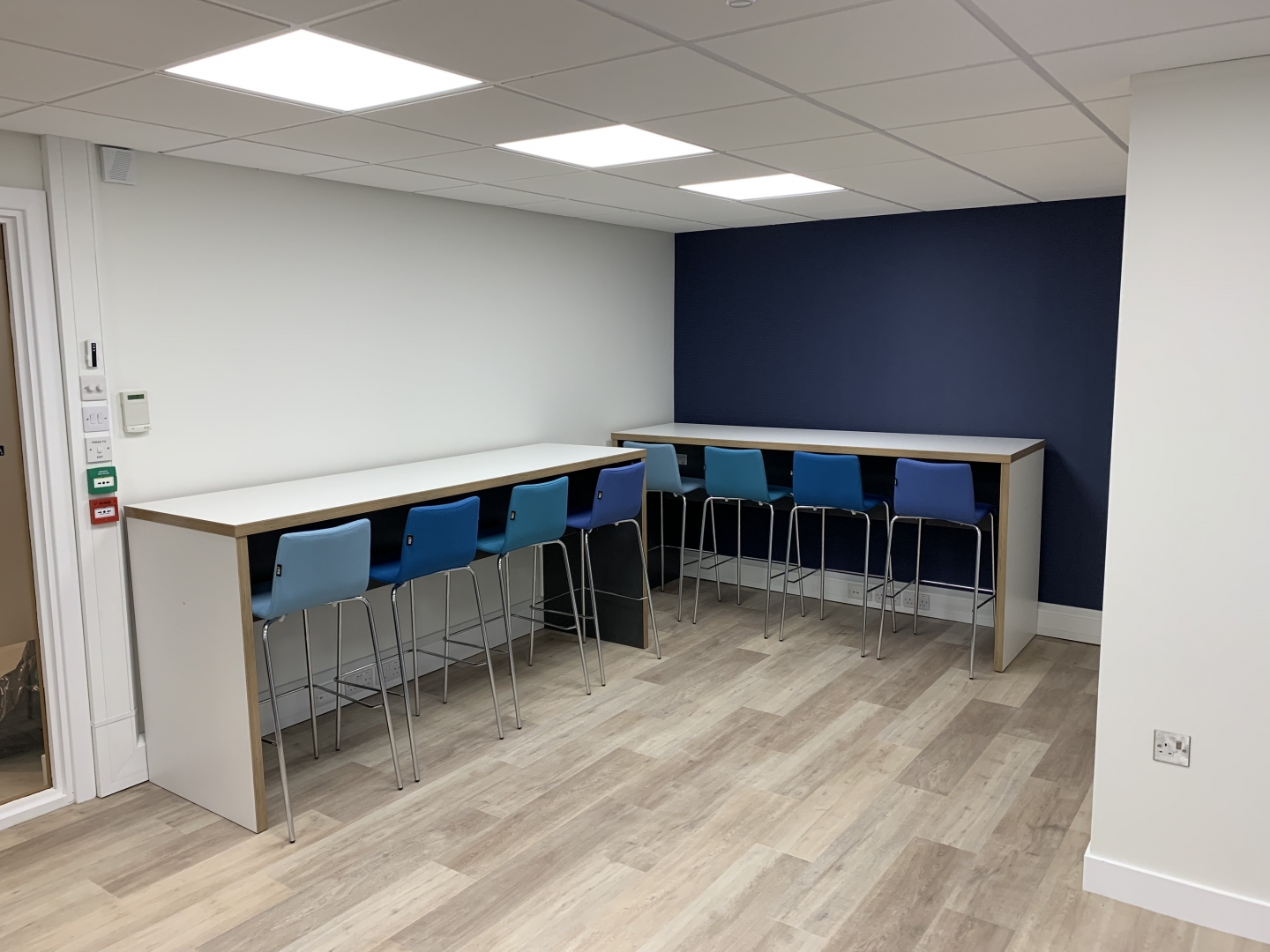 tables and high chairs in a staff breakout room 