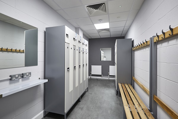 staff changing area with lockers and a bench 